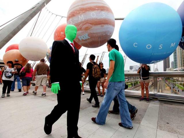 Costumed attendees walk on an overpass bridge during Comic Con in San Diego, California. (AFP Photo)