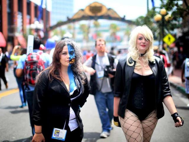 Costumed attendees walk down Fifth Avenue during Comic Con in San Diego, California. (AFP Photo)