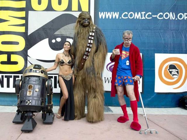 People in an eclectic collection of costumes pose together for a photo at Comic Con 2013 at the San Diego Convention Center in California. (AFP Photo)