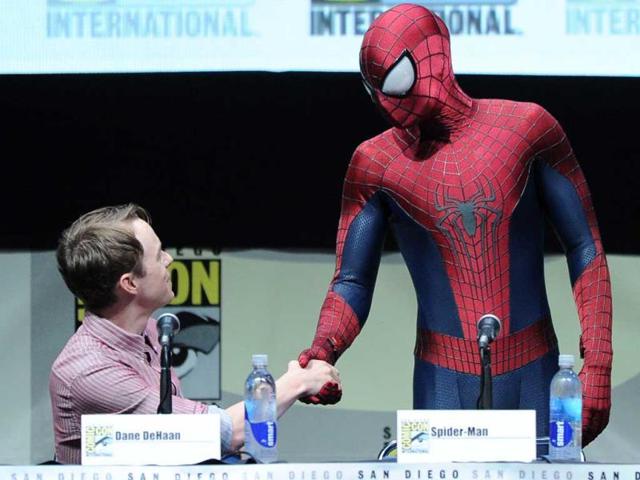 Actor Dane DeHaan (L) and Spider-Man speak onstage at the Sony and Screen Gems panel for 'The Amazing Spider-Man 2' during Comic Con International 2013 at the San Diego Convention Center in California. (AFP Photo)