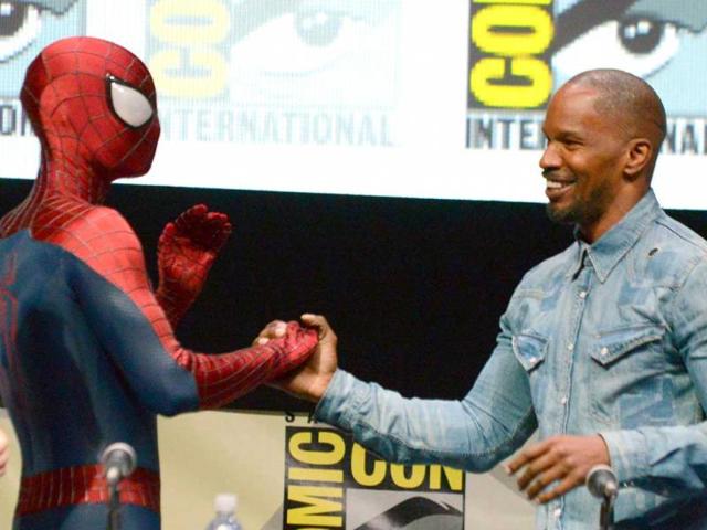 Spider-Man (L) and Jamie Foxx attend the 'The Amazing Spider-Man 2' panel on Day 3 of Comic Con International in San Diego. (AP Photo)