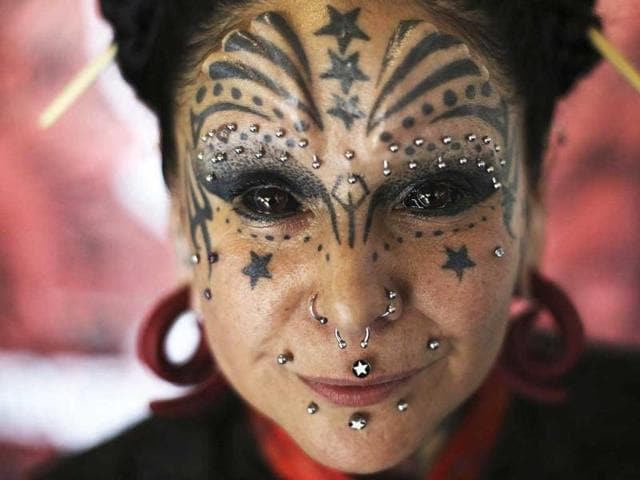 An attendee poses for a picture during the third International Tattoo Festival in Sao Paulo. (Reuters Photo)