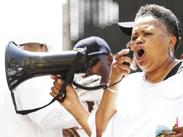 Monica Lewis-Patrick speaks at the Detroit Chapter of the National Action Network to protest against Trayvon Martin's death. (AP Photo)