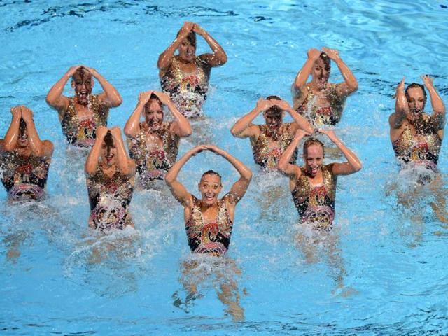 Canada's synchronised swimming team compete in the team free combination preliminary round during the synchronised swimming competition in the FINA World Championships at the Palau Sant Jordi in Barcelona, Spain. (AFP Photo)
