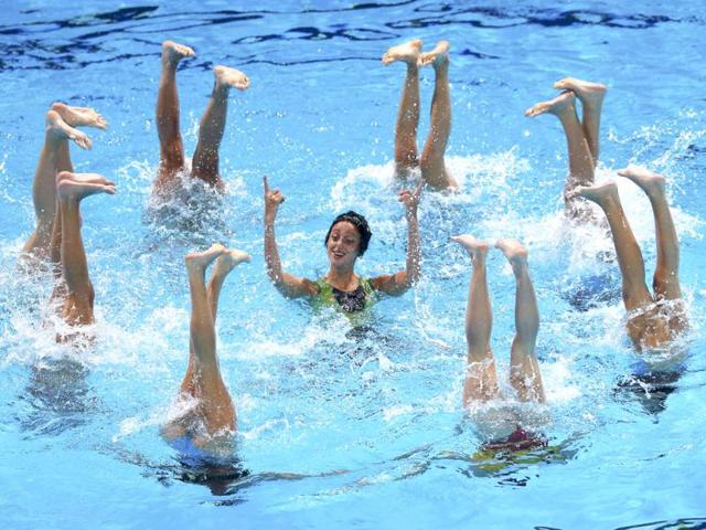 Italy's team perform in the synchronised swimming free combination routine preliminaries during the World Swimming Championships at the Sant Jordi arena in Barcelona, Spain. (Reuters)