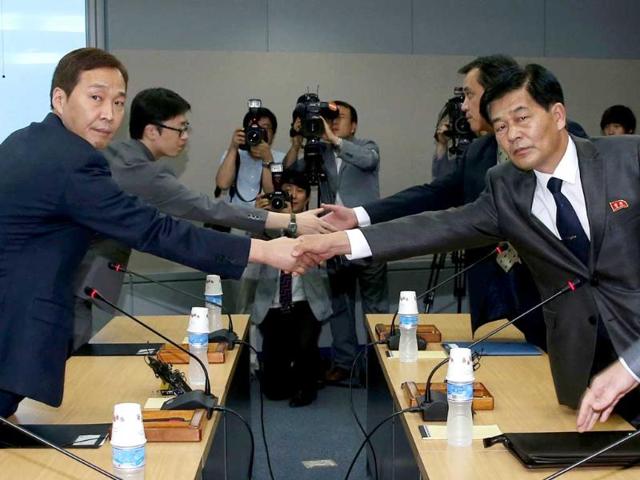 Head of the South Korean working-level delegation Kim Ki-woong (L) shakes hands with his North Korean counterpart Park Chol-su during their talks at the Kaesong Industrial District Management Committee in Kaesong. South and North Korea began their fifth working-level talks on Monday to discuss normalisation of operations at the jointly run industrial park, including the resumption of facility inspections, reported local media. REUTERS