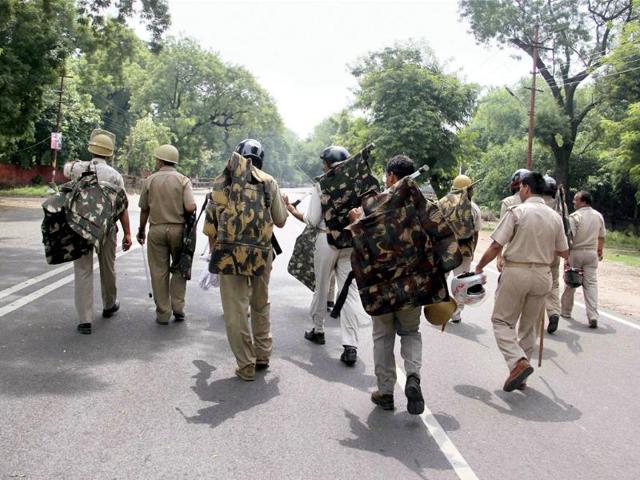 Policemen on duty to control expected students protest over the verdict on OBC candidate reservation at Uttar Pradesh Public Service Commission in Allahabad High Court, in Allahabad. PTI Photo