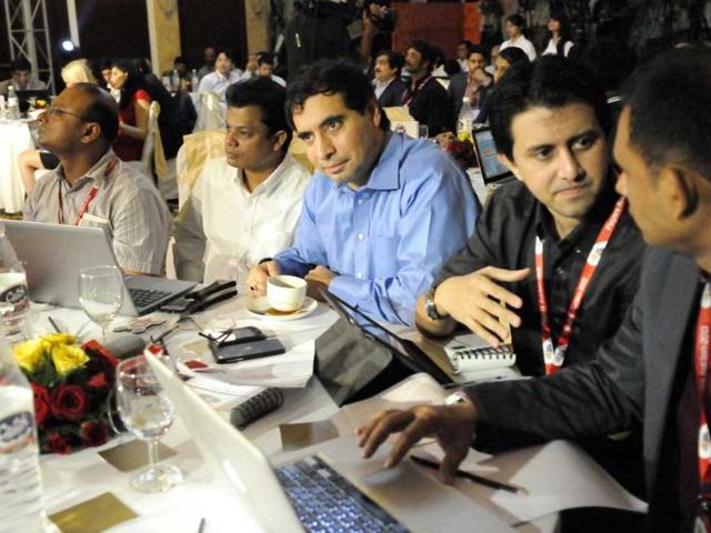 Team owners chat during a player auction of the Indian Badminton League, in New Delhi (HT photo)