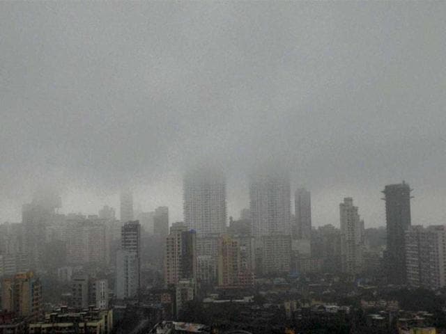 High-rise buildings during the heavy rains in Mumbai on Tuesday. (PTI Photo)