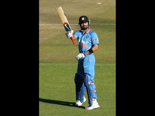 Virat-Kohli-raises-his-bat-after-scoring-his-century-AFP-Photo Virat-Kohli-raises-his-bat-after-scoring-his-century-AFP-Photo