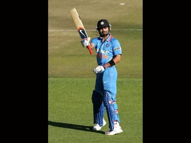 Virat-Kohli-raises-his-bat-after-scoring-his-century-AFP-Photo