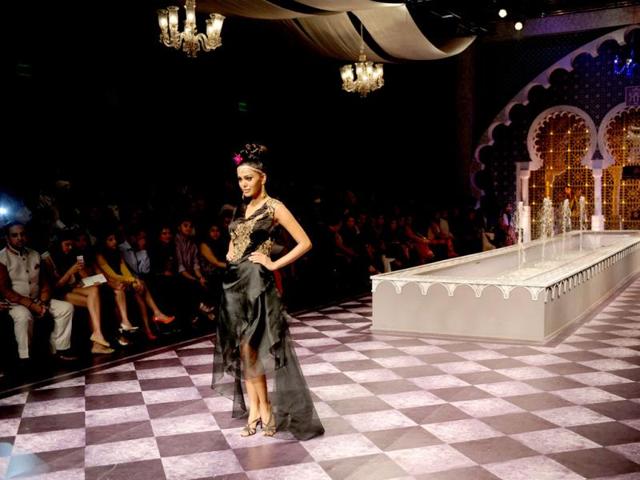 A model presents a creation by Raghavendra Rathore during the Indian Bridal Fashion Week in New Delhi. (AFP Photo)