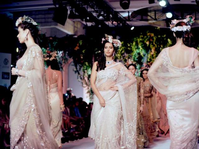 Models present creations by Falguni and Shane Peacock during the Indian Bridal Fashion Week in New Delhi. (AFP Photo)