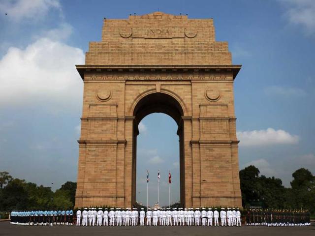 Soldiers from the three defense forces pay tribute at India Gate war memorial on the 14th anniversary of India's victory in the Kargil War in New Delhi, India. (AP Photo)