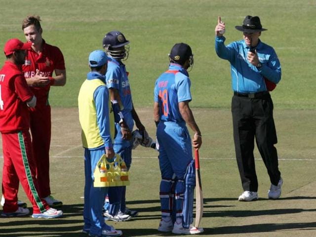 India captain Virat Kohli is given out by umpire Bruce Oxenford after a review during the second ODI against hosts Zimbabwe at the Harare Sports Club. (AFP Photo)