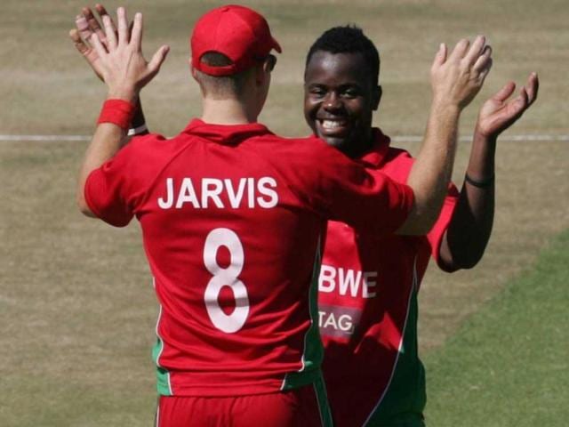 Zimbabwe's Brian Vitori celebrates a wicket with team mate Kyle Jarvis during the second ODI against India at the Harare Sports Club, in Harare. (AFP Photo)