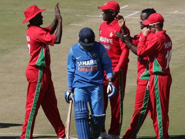 Zimbabwe players celebrate the wicket of India's Ambati Rayadu during the second ODI at the Harare Sports Club, in Harare. (AFP Photo)