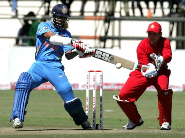 India's Shikhar Dhawan bats as Zimbabwean captain Brendan Taylor looks on during the second ODI between Zimbabwe and India at the Harare Sports Club. (AFP Photo)