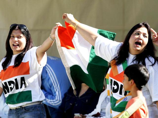 Supporters of the Indian cricket team wave the Tricolour during the second ODI against Zimbabwe at the Harare Sports Club. (AFP Photo)