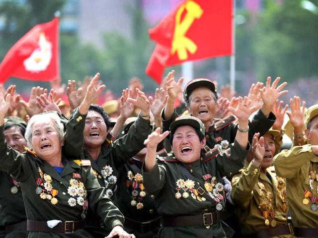 North Korean war veterans cry as they parade past their leader Kim Jong Un at the mass military parade in Pyongyang, North Korea. (AP Photo)
