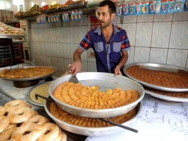 A man stacks sweets at his shop during the Muslim fasting month of Ramzan in Baghdad. (AFP photo)