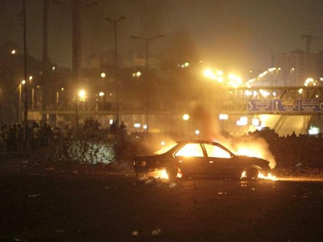 A car that members of the Muslim Brotherhood and supporters of deposed Egyptian President Mohamed Mursi say was burnt by police and plain-clothed people is seen during clashes in Nasr city area, east of Cairo July 27, 2013. REUTERS