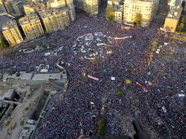 Egyptian army, opponents of Egypt's ousted President Morsi protest at Tahrir Square in Cairo, Egypt. (AP Photo)