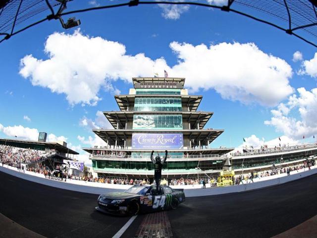 Kyle Busch, driver of the #54 Monster Energy Toyota, celebrates after winning the NASCAR Nationwide Series Indiana 250 at Indianapolis Motor Speedway in Indianapolis, Indiana. (AFP Photo)