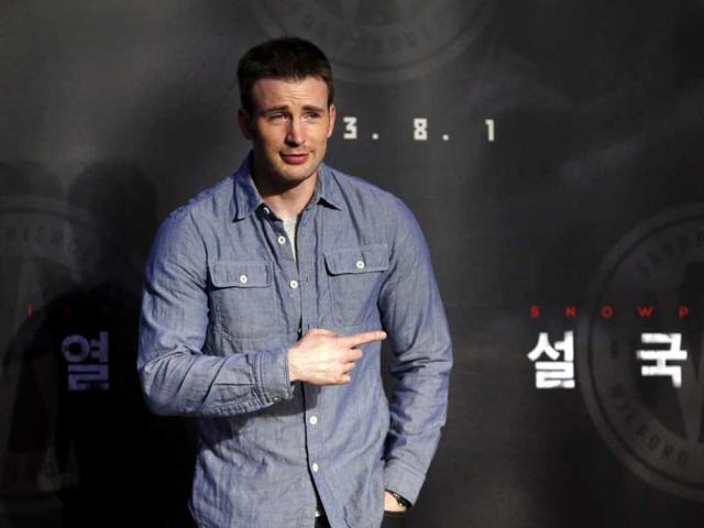 Cast member Chris Evans poses for photographs during a news conference to promote his latest movie "Snowpiercer" at a hotel in Seoul. (Reuters)