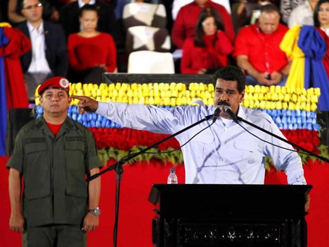 Venezuela's President Nicolas Maduro speaks during a ceremony to commemorate the 59th birthday of Venezuelan late President Hugo Chavez at the 4F military fort in Caracas. (Reuters)