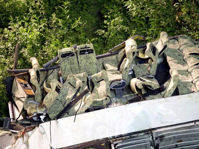Wrecked bus seats are seen after a bus plunged off the A16 highway near Avellino, southern Italy, early. (AP Photo)