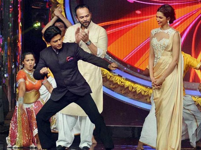 Shah Rukh Khan and Deepika Padukone promote Chennai Express on the sets of a TV show on Sunday. (PTI Photo)