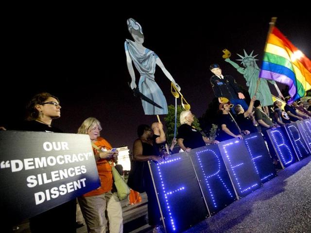 Supporters of Army Pfc. Bradley Manning demonstrate infront of the White House during a night time rally in Washington. (AP Photo)