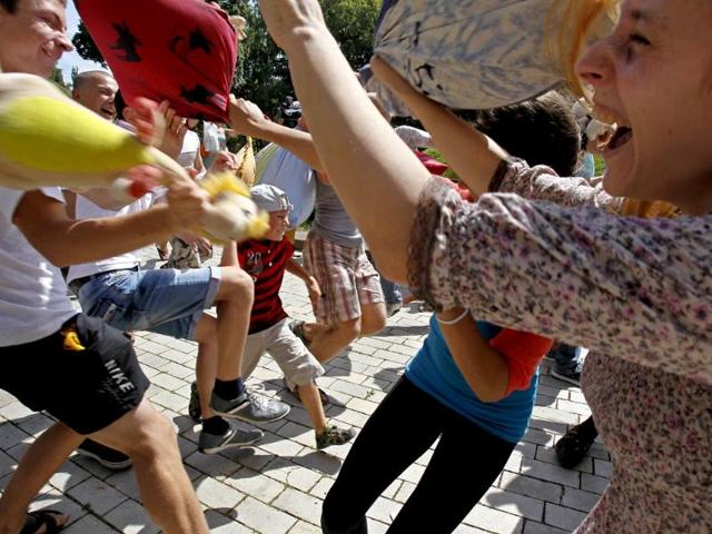 Youths fight with pillows during a flash mob in a park in central Kiev. Some 100 people participated in a social media flash mob called Pillow Fight. Reuters photo