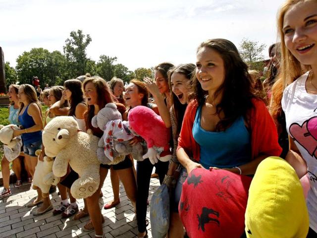 Youths prepare for a fight with pillows during a flash mob in a park in central Kiev. Some 100 people participated in a social media flash mob called Pillow Fight. Reuters photo