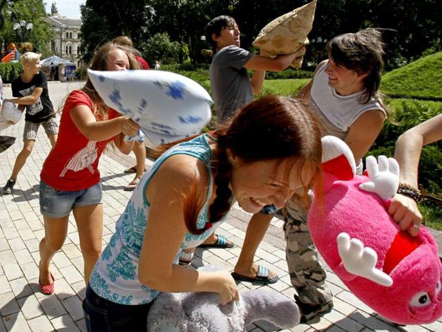 Youths fight with pillows during a flash mob in a park in central Kiev. Some 100 people participated in a social media flash mob called Pillow Fight. Reuters photo