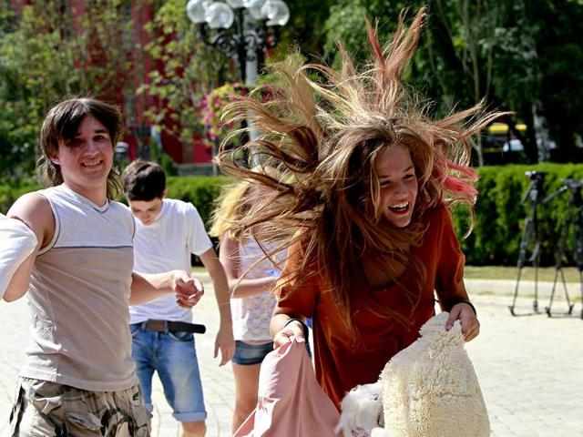Youths fight with pillows during a flash mob in a park in central Kiev. Some 100 people participated in a social media flash mob called Pillow Fight. Reuters photo