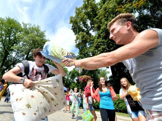 Young people fight with pillows during a happening called Battle With Pillows in Kiev. Hundreds of young Ukrainians entertain themselves organizing events via social networks. AFP photo