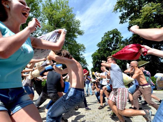 Young people fight with pillows during a happening called Battle With Pillows in Kiev. Hundreds of young Ukrainians entertain themselves organizing events via social networks. AFP photo