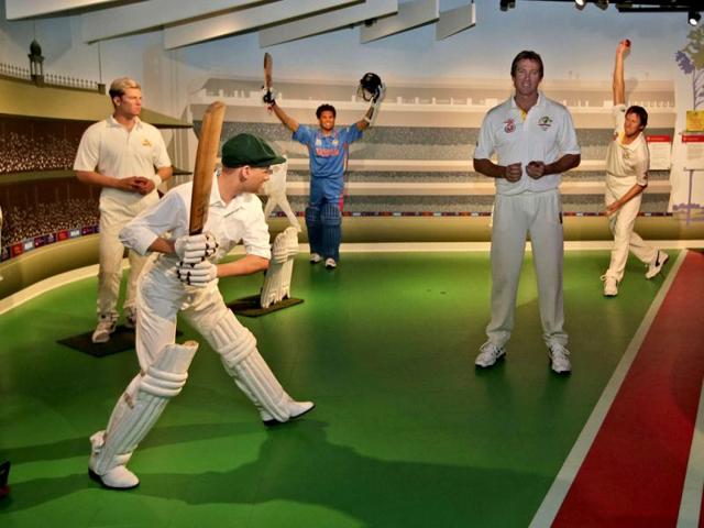 Former Australian cricket player Glenn McGrath (2nd R) poses among cricket legends (from left), Shane Warn, Donald Bradman, Sachin Tendulkar and a wax statue of himself (R) at Madame Tussauds in Sydney. (AP Photo)