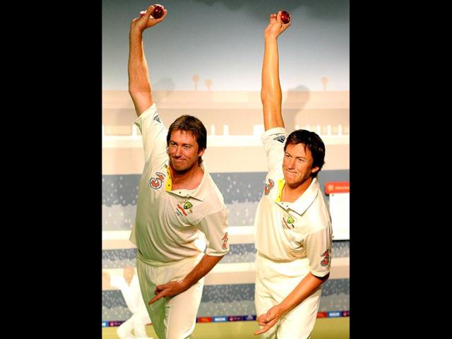 Australia's cricket legend Glenn McGrath (L) poses for photos during the launch of his wax figure at Madame Tussauds in Sydney. (AFP Photo)
