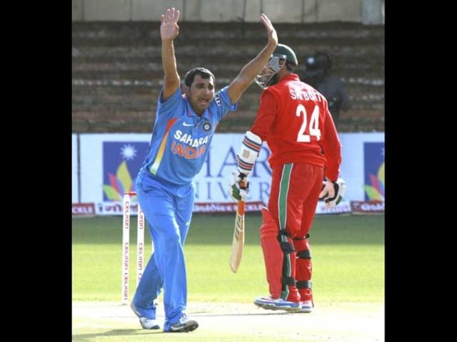 Mohammad Shami, left, appeals unsuccessfully for the wicket of Sikanda Raza Butt during their one-day international cricket match at Queens Sports Club in Bulawayo, Zimbabwe. (AP Photo)