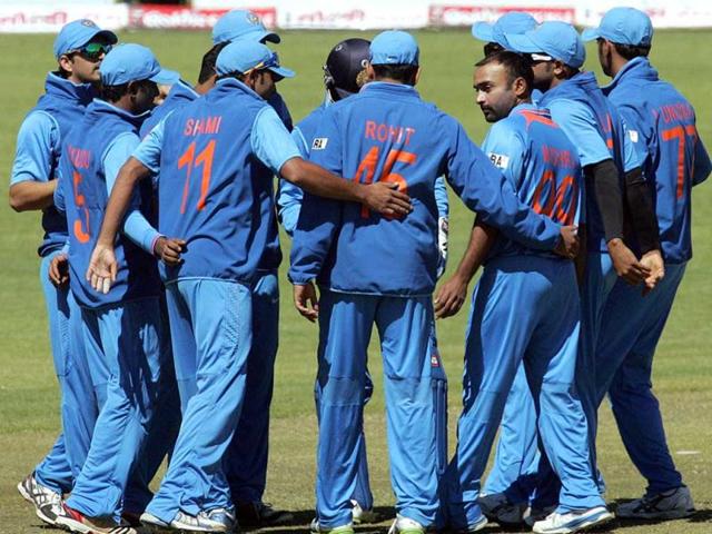 Indian players in a huddle as they have Zimbabwe under pressure during the 4th match of the 5-match cricket ODI series between Zimbabwe and India at Queen's Sports Club in Harare. (AFP Photo)