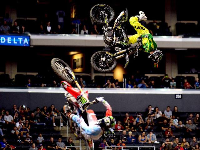 Blake Williams (R) and Nate Adams (L) compete for the Gold medal in the Moto X Speed and Style at the X Games in Los Angeles, California. (AFP Photo)