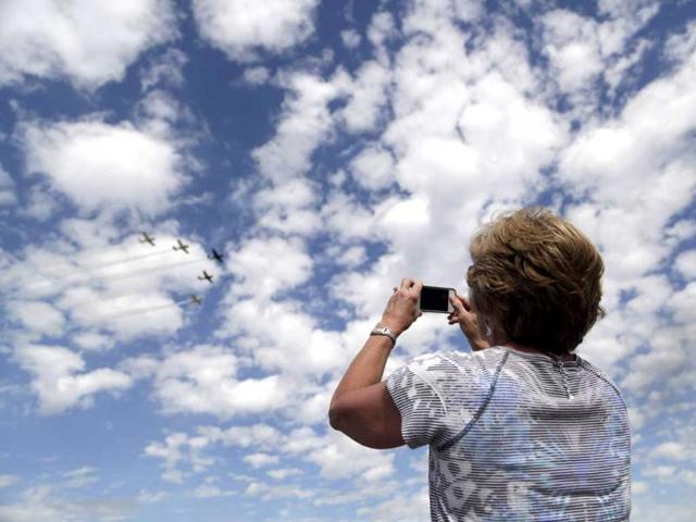 An aviation enthusiast attends the air show at the EAA AirVenture at Wittman Regional Airport in Oshkosh, Wisconsin August. REUTERS