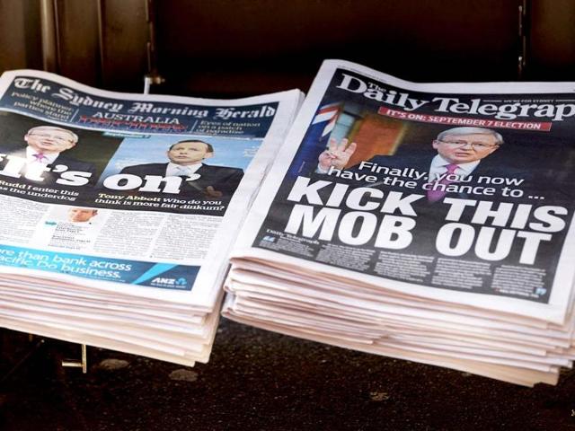 Rupert Murdoch's Sydney Daily Telegraph newspaper, with the Fairfax Media's Sydney Morning Herald newspaper, are displayed on a news stand in Sydney. (AFP photo)