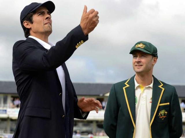 England's captain Alastair Cook (L) tosses the coin as Australia's captain Michael Clarke looks on before the fourth Ashes Test at the Riverside cricket ground in Chester-le-Street. (Reuters Photo)