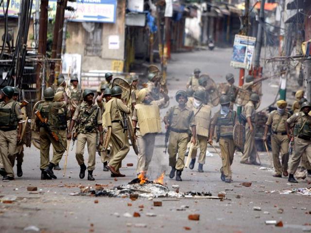 Paramilitary soldiers patrol during a protest against the state government after rival communities clashed in Kishtwar, in Jammu. (AP Photo)