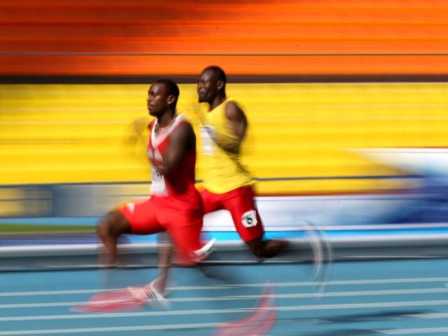 Guinea-Bissau's Holder da Silva (L) and Antigua's Daniel Bailey run during the men's 100 metres qualifications at the 2013 IAAF World Championships at the Luzhniki stadium in Moscow. (AFP Photo)