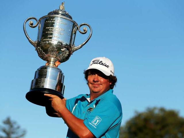 Jason Dufner of the United States poses with the Wanamaker Trophy after his two-stroke victory at the 95th PGA Championship at Oak Hill Country Club in Rochester, New York. AFP